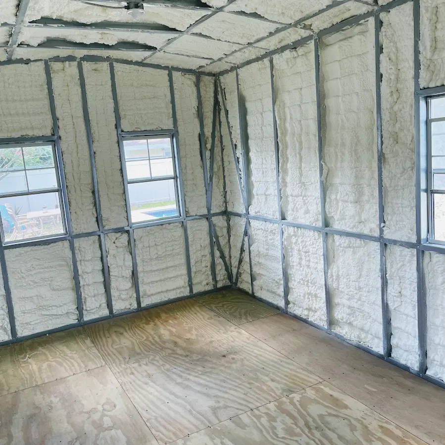 Closed-cell spray foam insulation applied to wall cavities in a residential project in Schoolcraft
